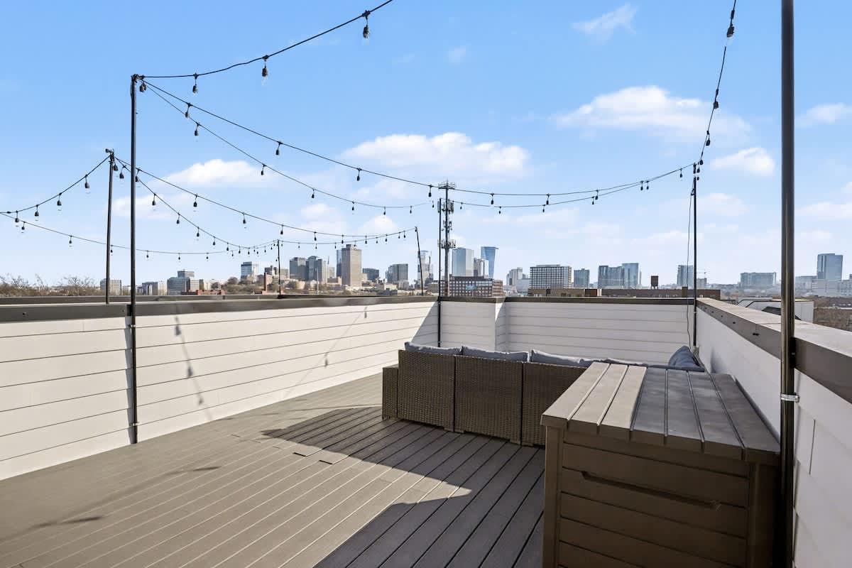 4th Floor: Rooftop patio with an outdoor lounge area and a view of the Nashville skyline.