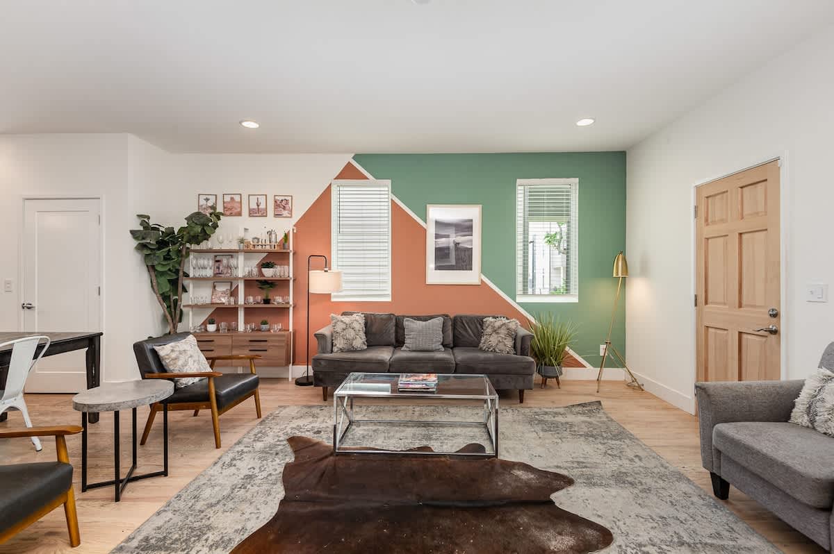 Open-concept living area with cozy furnishings, a Smart TV, and a fireplace.