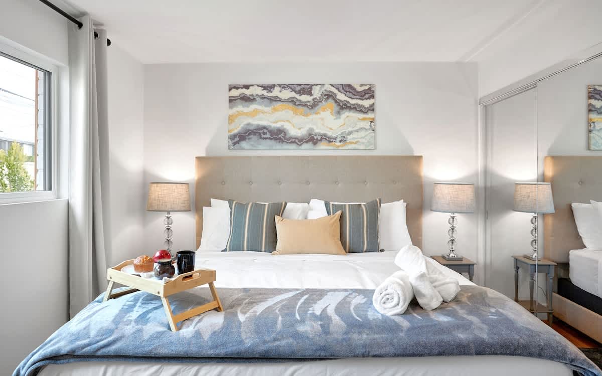 Primary Bedroom featuring a King bed with a smart TV, closet, and en-suite bathroom.