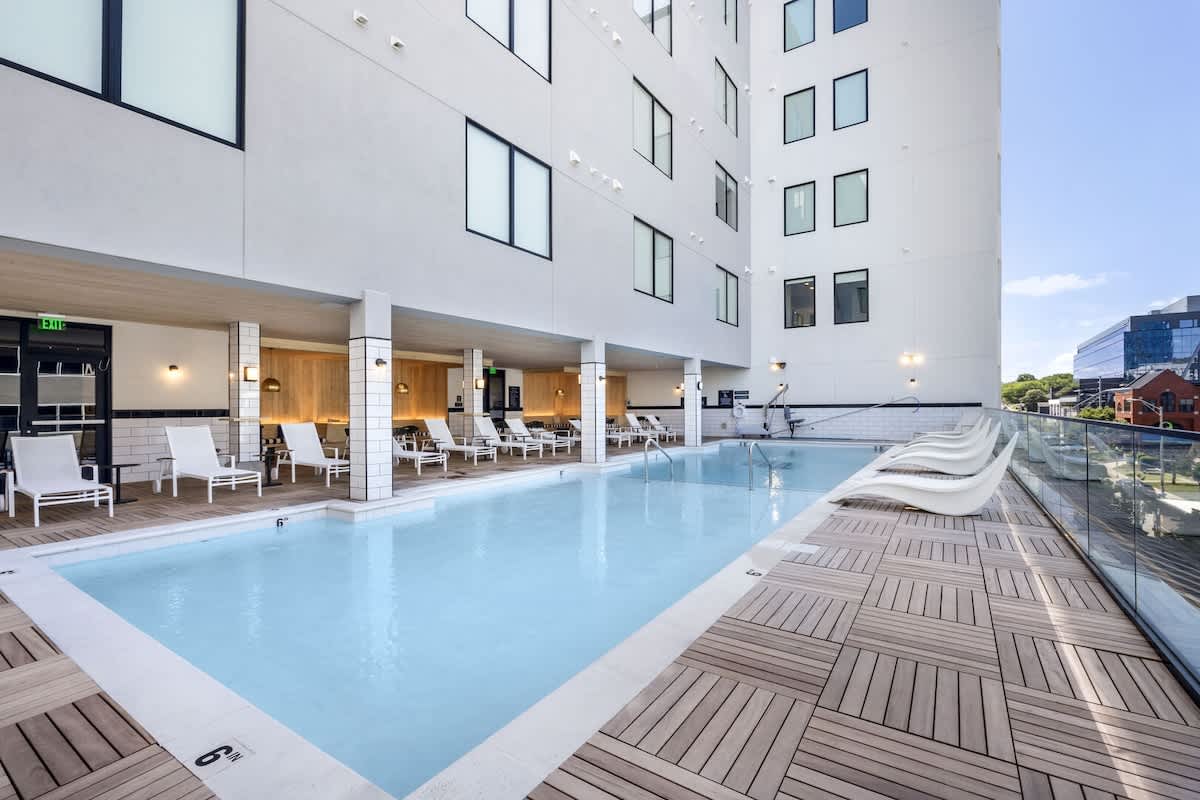 Communal Area: The Sparkling blue pool on the 3rd floor has city views and sun loungers.
