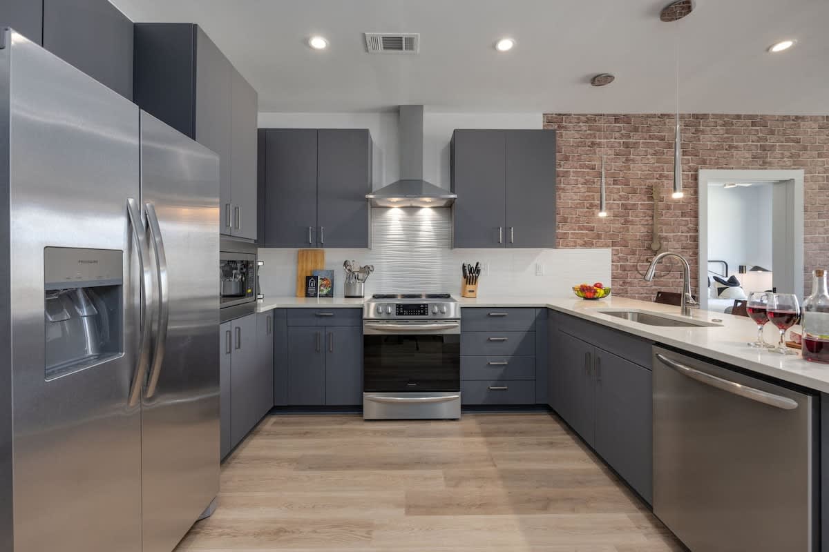 Experience the joy of cooking in a fully equipped kitchen with top-tier stainless steel appliances, sleek granite countertops, and cozy breakfast bar seating.