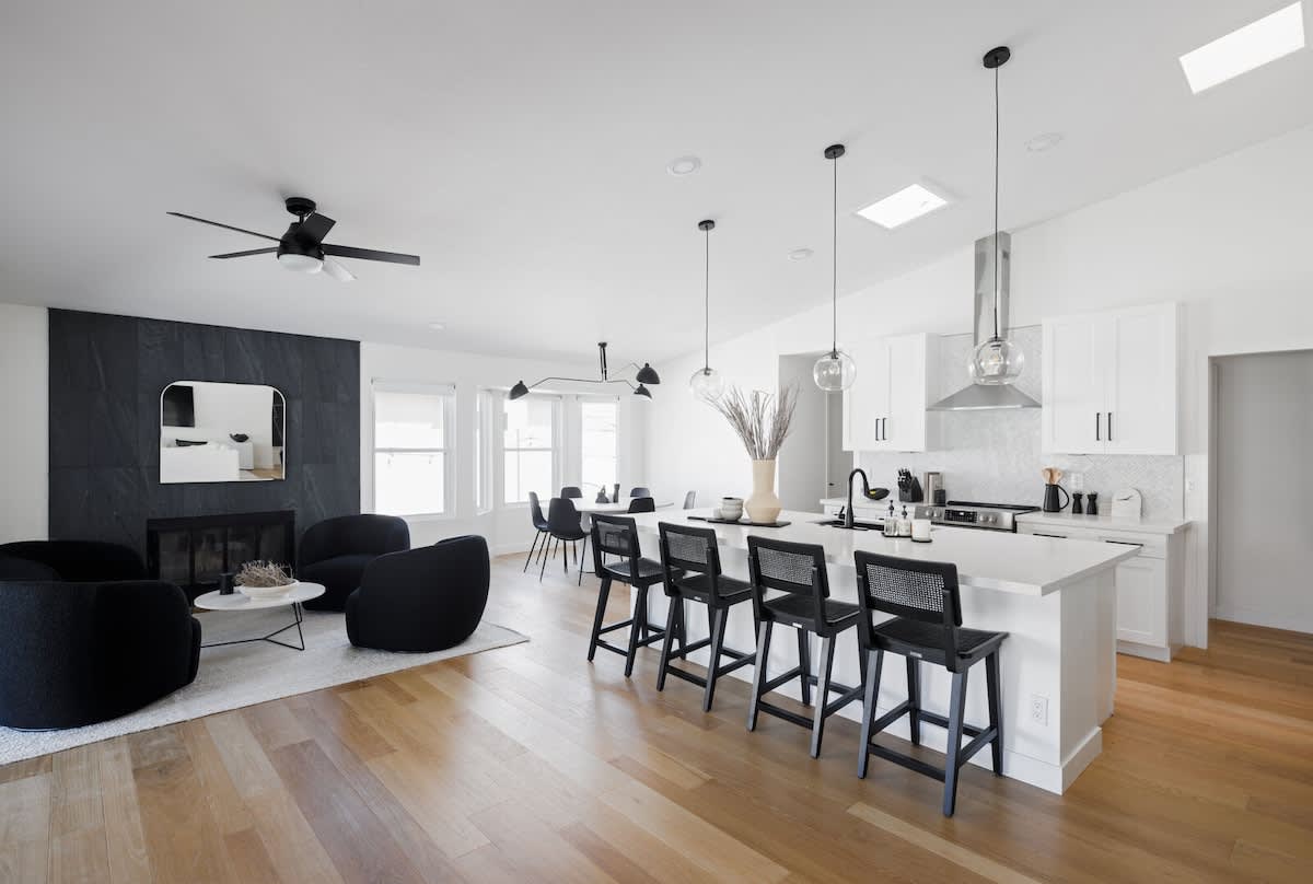 Open concept kitchen with stainless steel appliances, breakfast bar island seating, tons of natural light, and fully stocked with your basic cooking essentials.