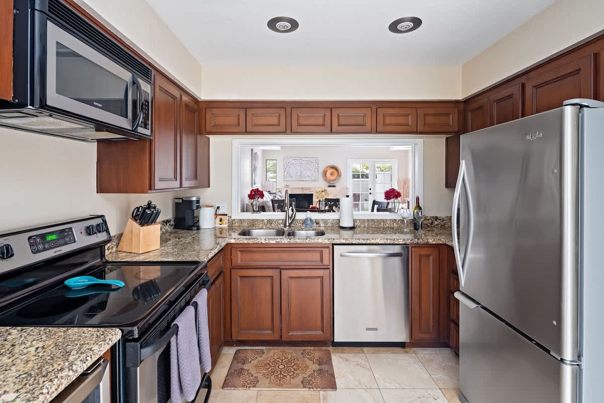 1st Floor: Fully equipped kitchen featuring stainless-steel appliances and completely stocked with all culinary essentials for ease and convenience during your stay.