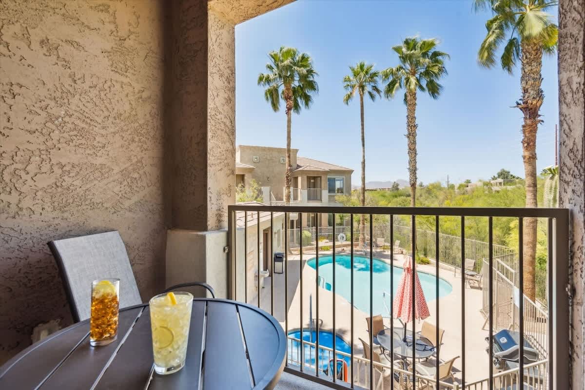 Enjoy a peaceful retreat on the Balcony overlooking the pool, complete with seating for two.