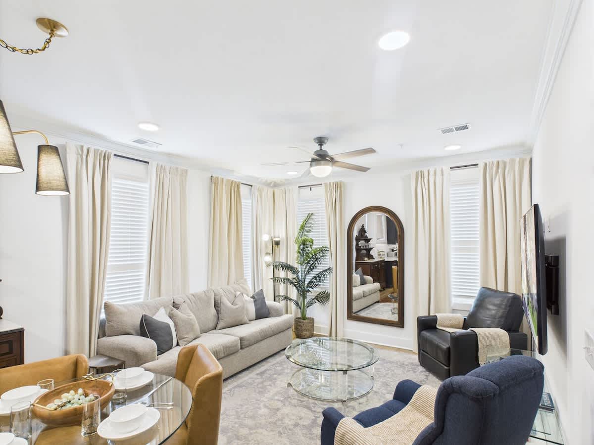 A warm and inviting living room features comfortable furnishings and decor to make you feel at home. A Smart TV provides entertainment, and the living room sofa converts into a Queen-size bed for extr