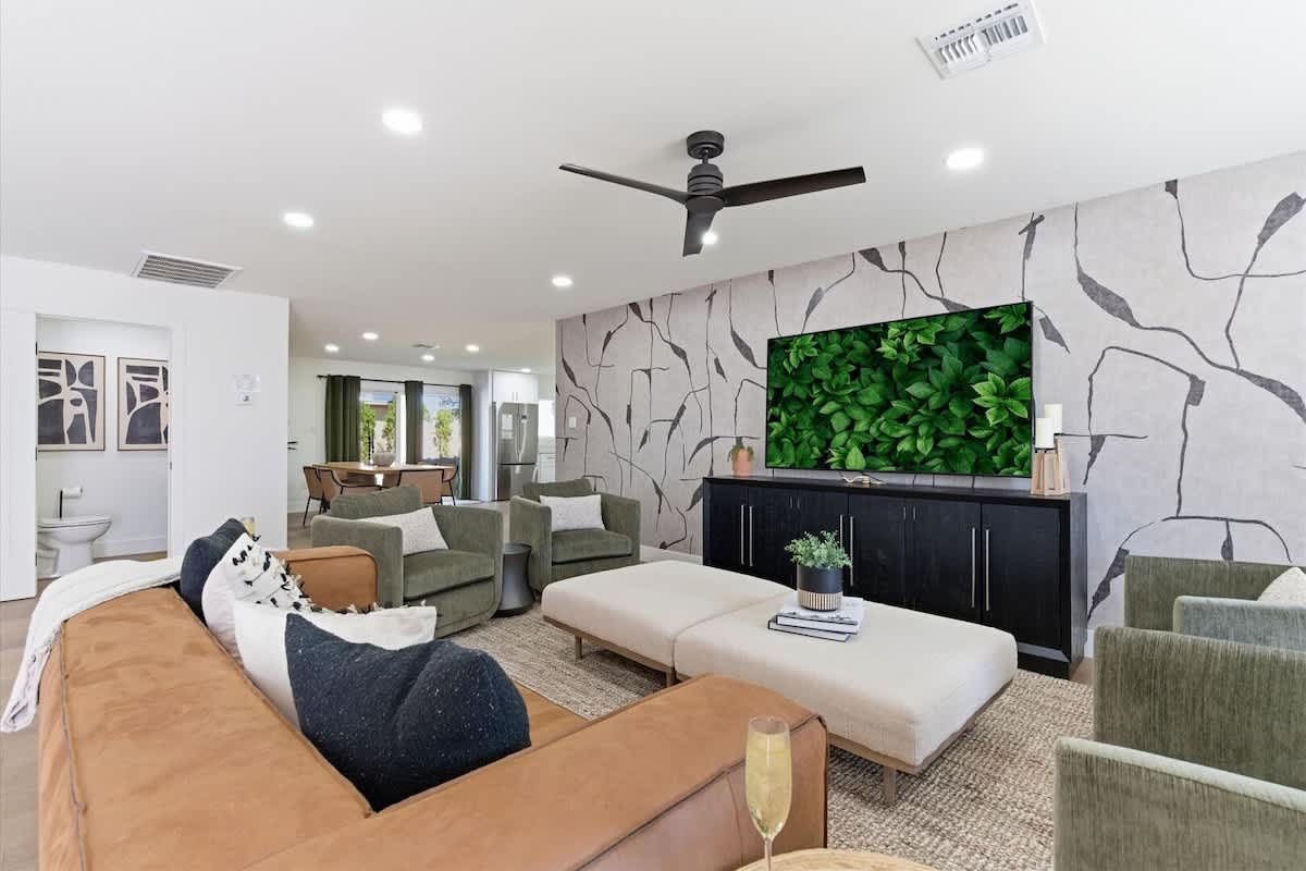 Open-concept living area featuring cozy furnishings, a smart TV, and plenty of space to relax and unwind.