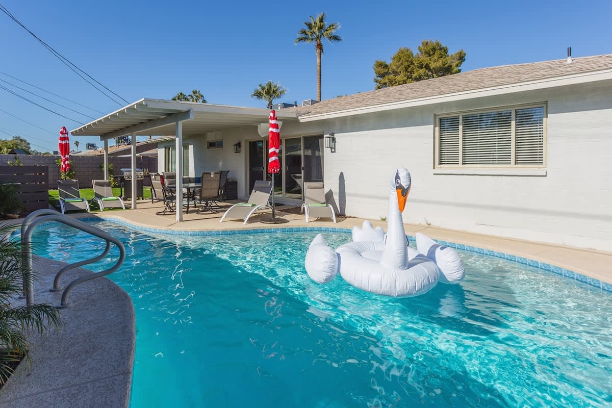 Private backyard with recently resurfaced private pool with brand new pool lights.