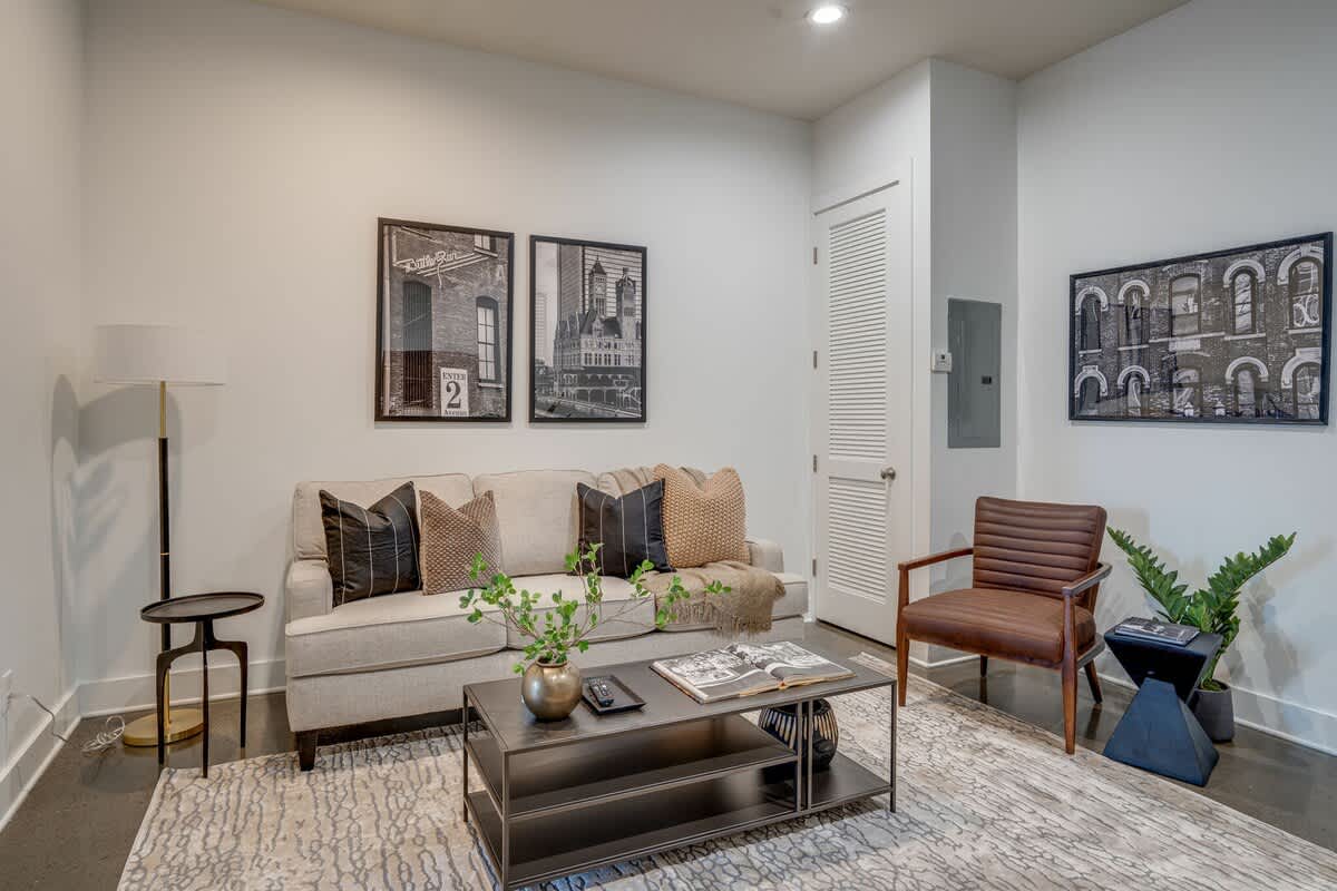 Unit 2: Open concept living area with smart TV and cozy furnishings.