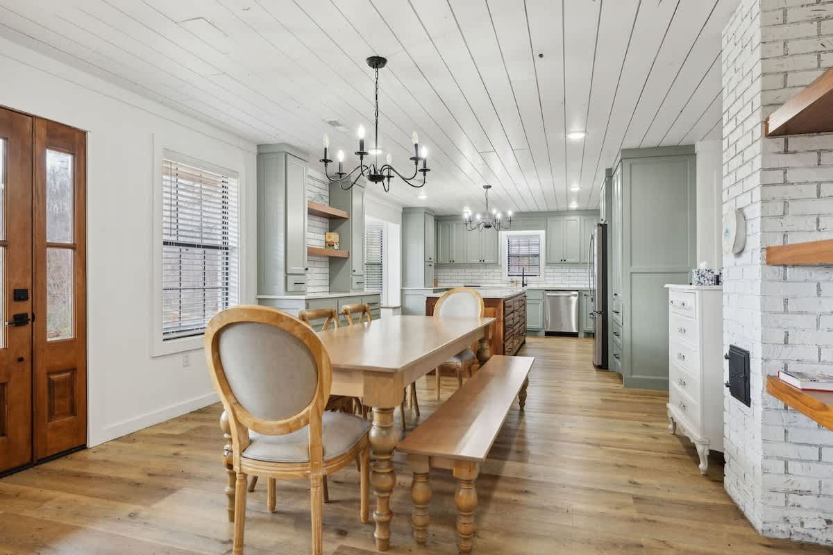 Large dining area next to the kitchen with seating for 8 guests. Fully equipped modern kitchen stocked with all culinary essentials and featuring brand new stainless steel appliances with an island of