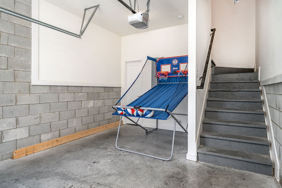 Garage doubles as a fun zone with an indoor basketball hoop game—perfect for some friendly competition! (Lower Floor)