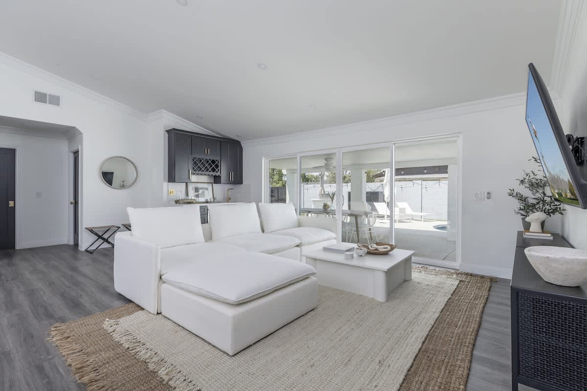 Bright living room with large flat screen TV