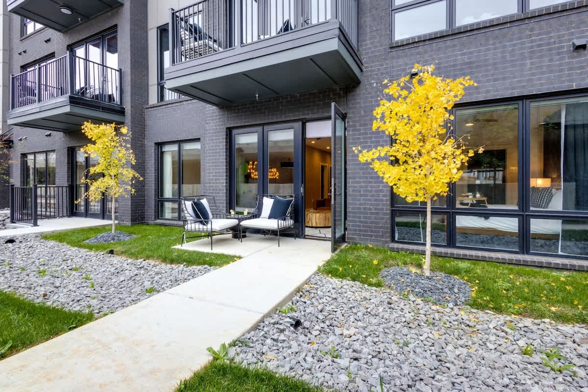 Outdoor patio space accessible from the living area complete with outdoor furniture.