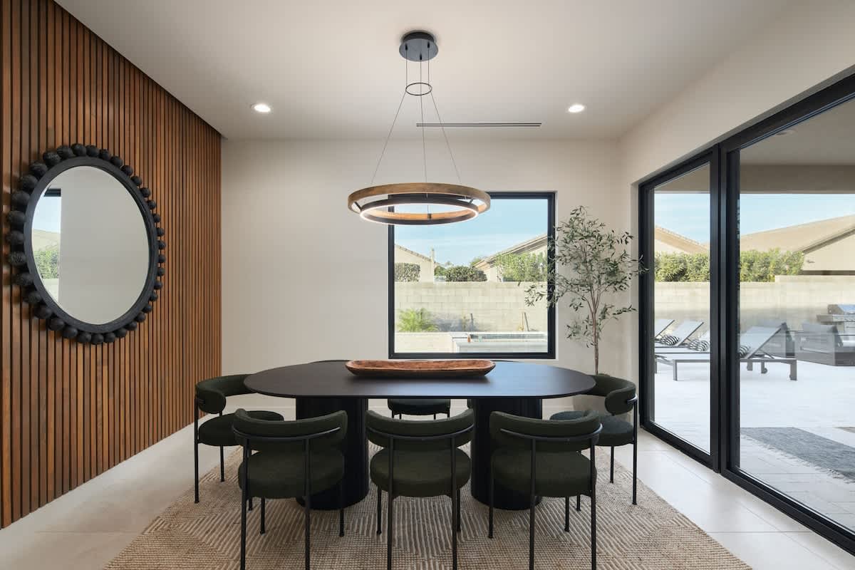 Formal dining room featuring a large table to accommodate up to 8 guests.