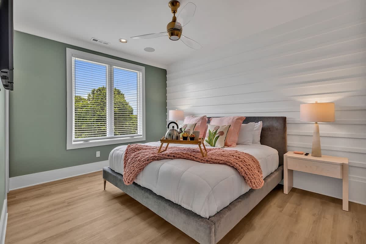 Unit 1 - 3rd Floor: Primary bedroom with a King bed, smart TV, large walk-in closet, and en-suite bathroom.
