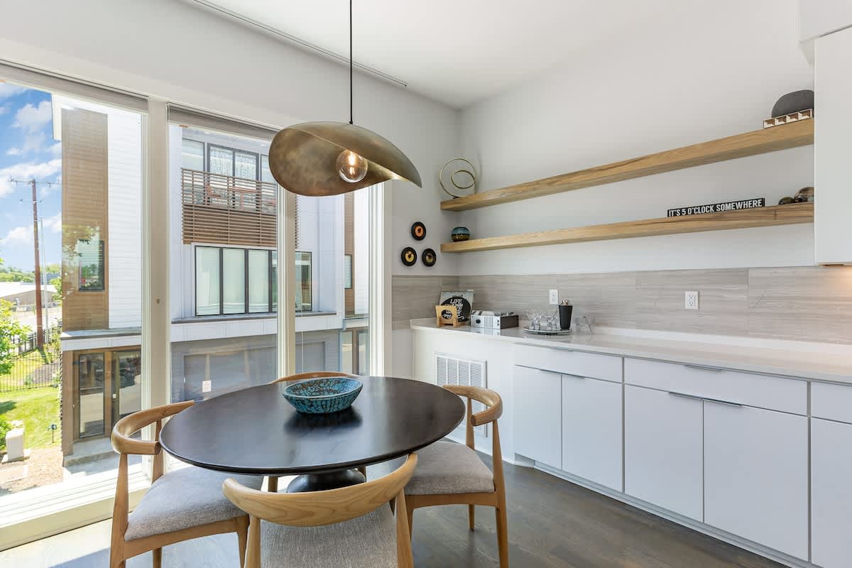 Designer furnishings surround the dining table for 4. (2nd Floor)