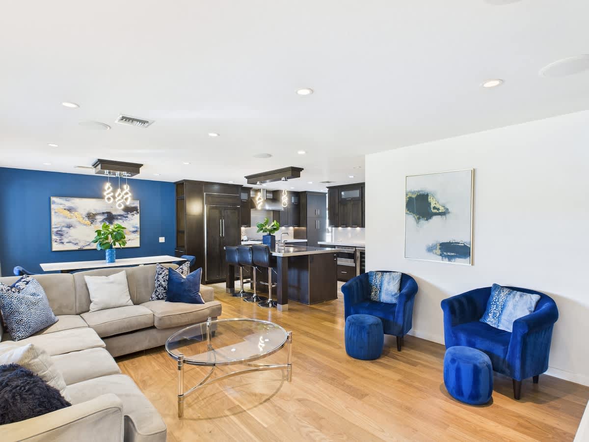 Bright and open living area featuring cozy furnishings, and a Smart TV.