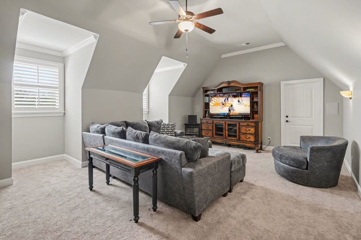 2nd living area featuring a smart TV, cozy furnishings, and a wetbar area with a mini fridge.