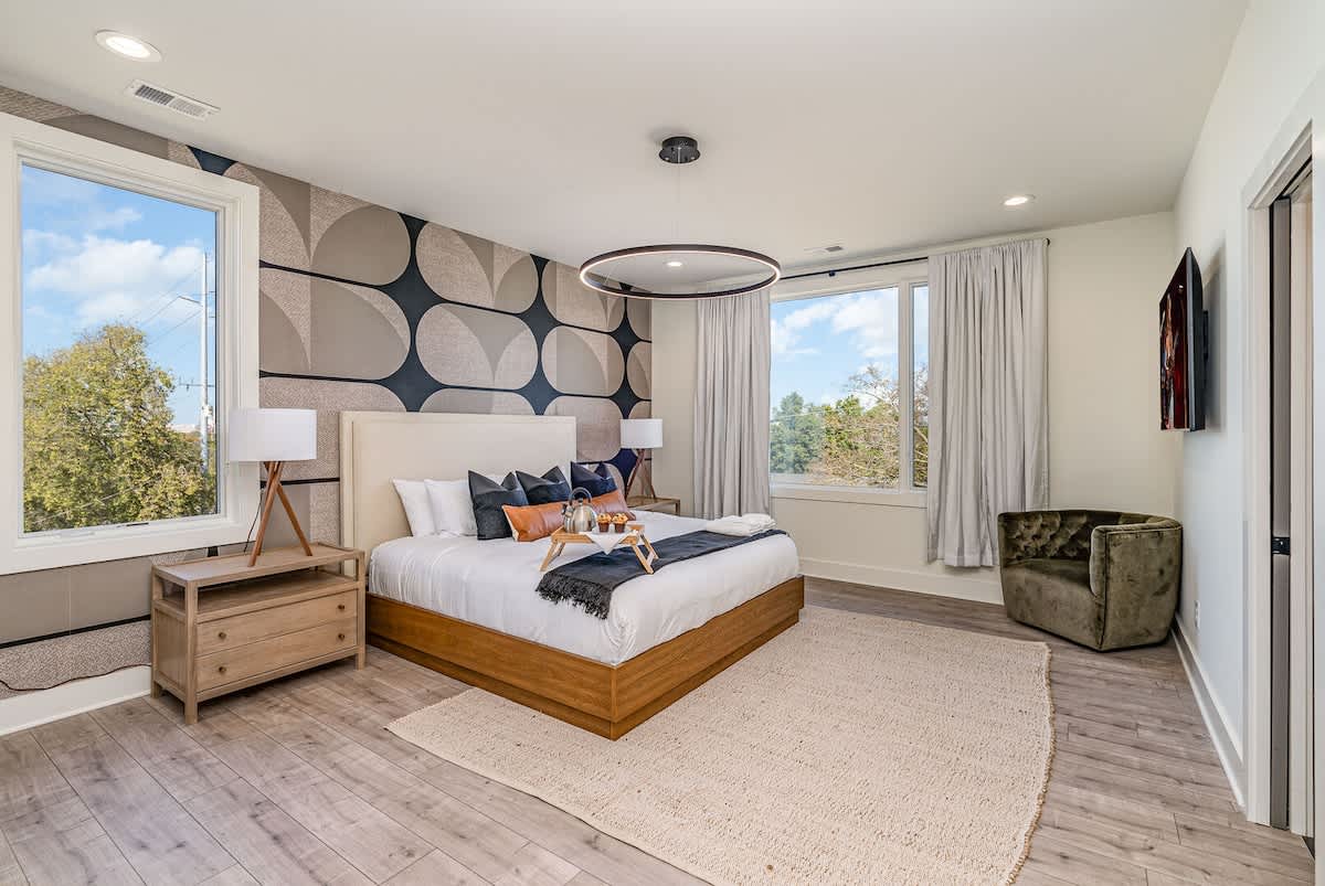 Primary bedroom with a King bed, smart TV, large walk-in closet, and en-suite bathroom. (3rd Floor)