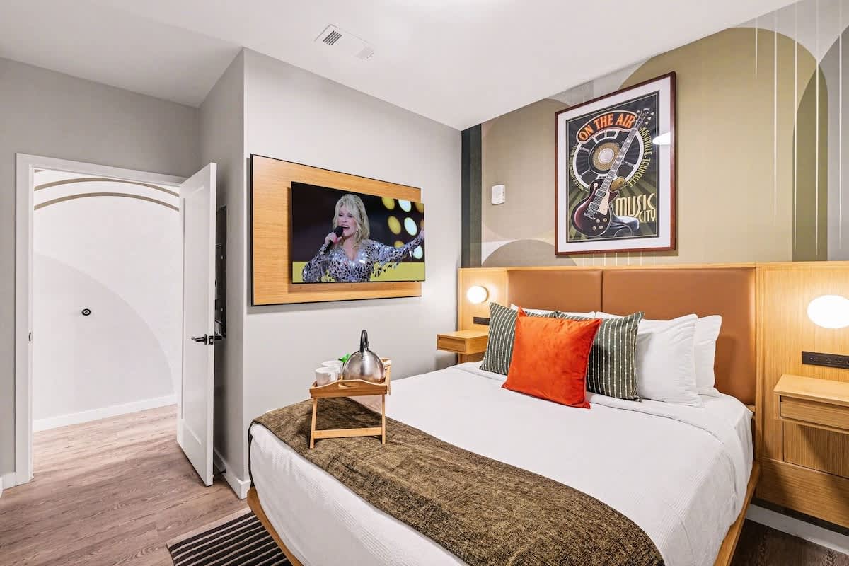 Primary Bedroom featuring a Queen bed, smart TV, and closet space.