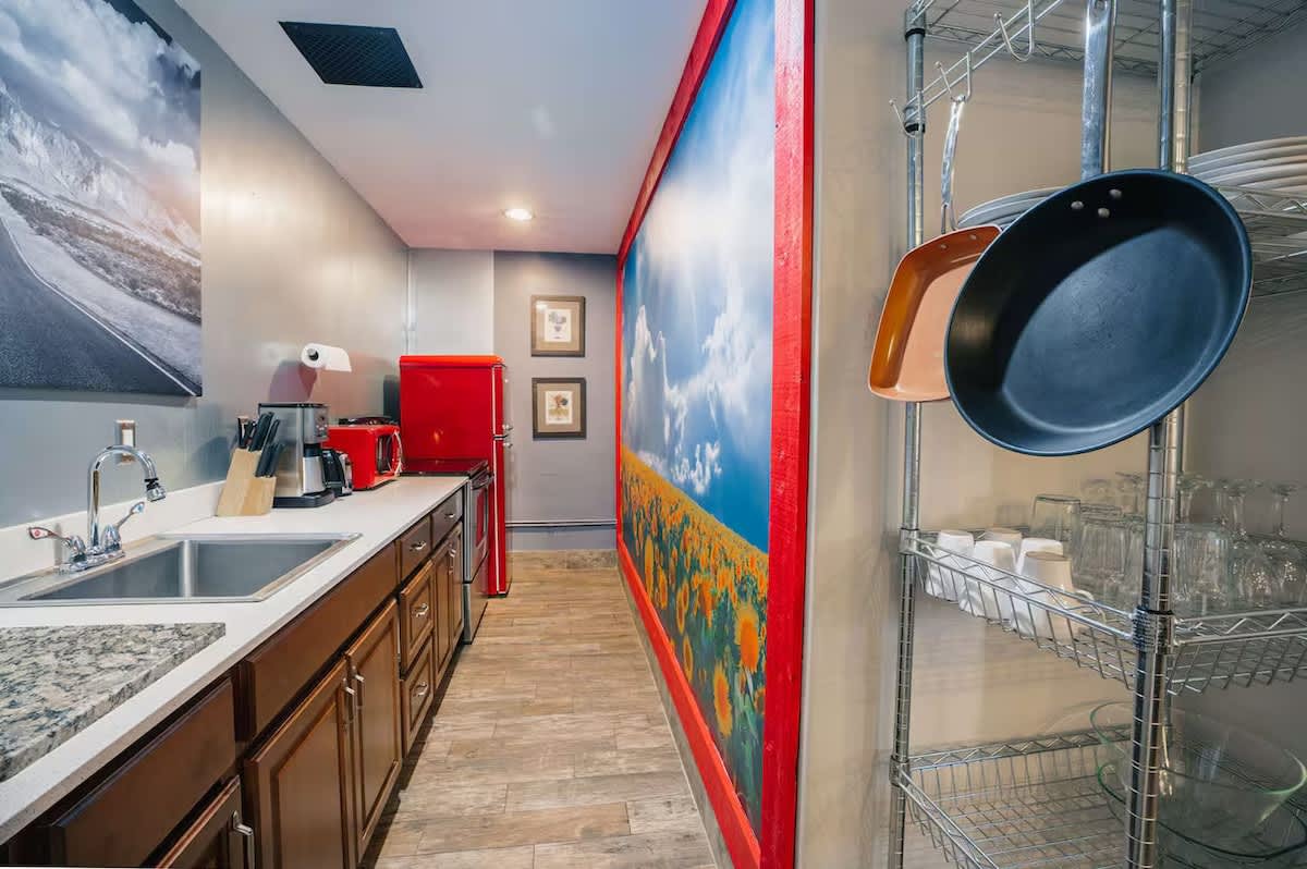Unit 3: Fully equipped kitchen with modern appliances, nature themed decor, and plenty of counter space for easy meal prep.