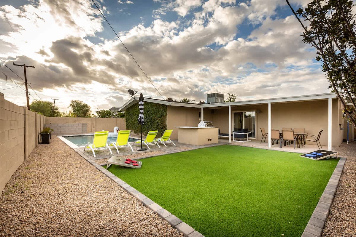 Your private backyard oasis with a heated pool, fire pit, and BBQ grill—ideal for sun or sunset relaxation.