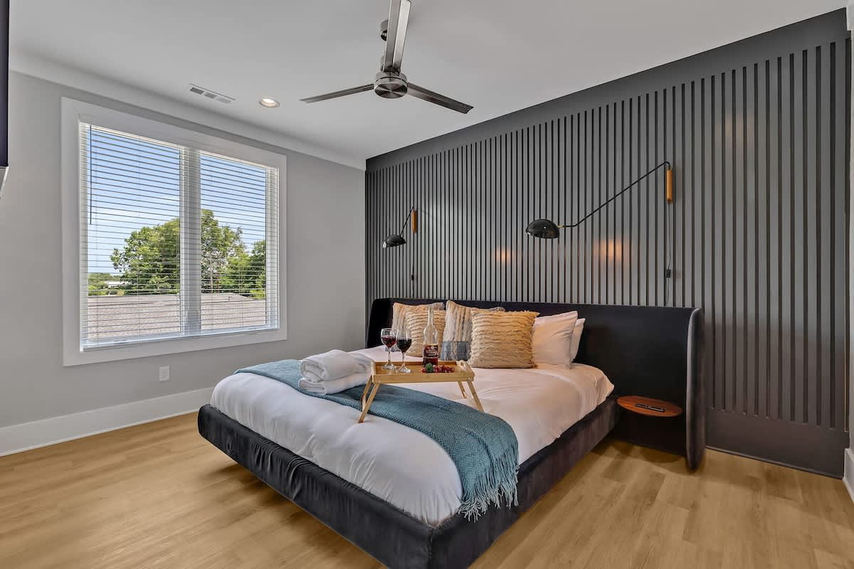 3rd Floor: Primary Bedroom featuring a luxurious King bed with a Smart TV, a walk-in closet and an ensuite Primary Bathroom.