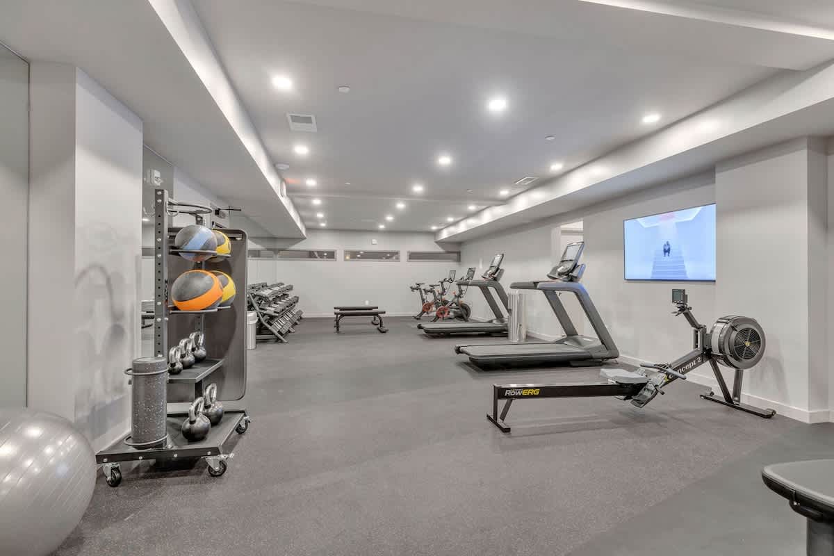 Communal Area: Gym offering a wide range of workout equipment and a smart TV.