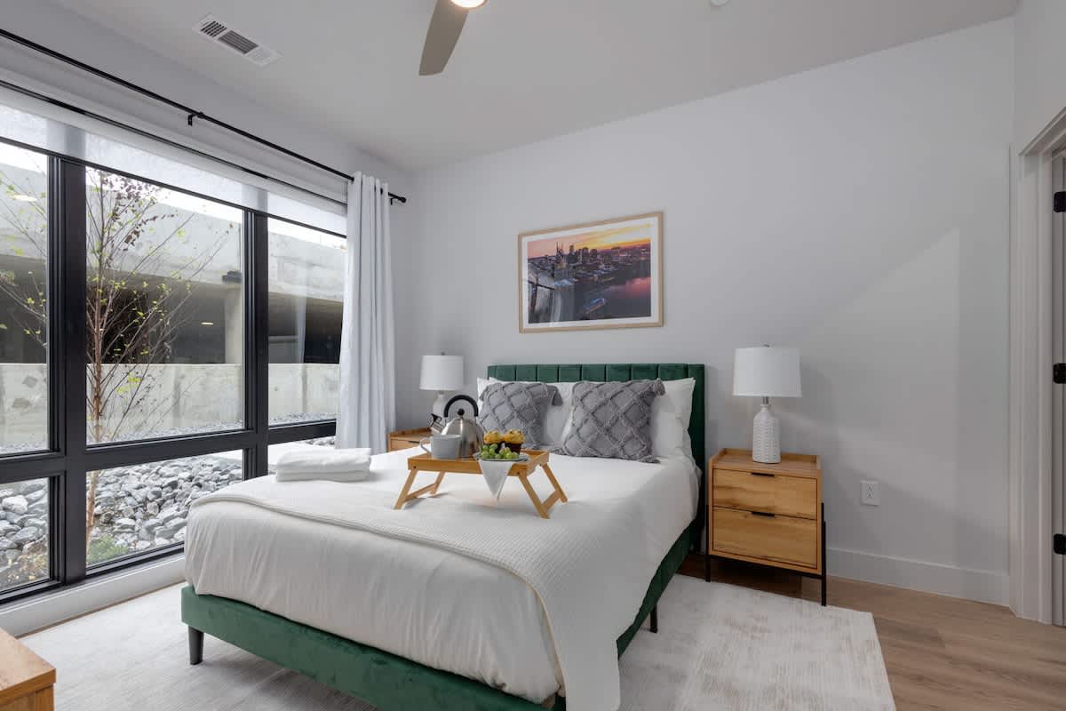 Primary Bedroom with a Queen bed, a large walk-in closet, and an ensuite bathroom.