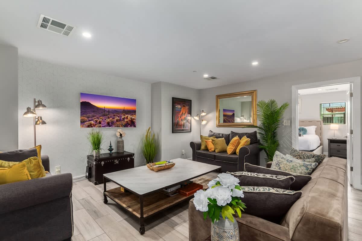 Warm & inviting designer furnished living room featuring a Smart TV for entertainment pleasure.