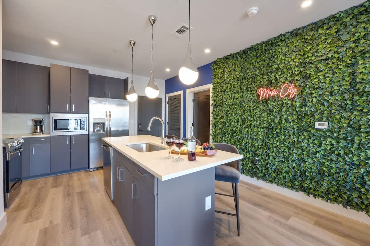 Unit 2: Fully equipped kitchen stocked with your basic cooking essentials, stainless steel appliances, and breakfast bar seating.