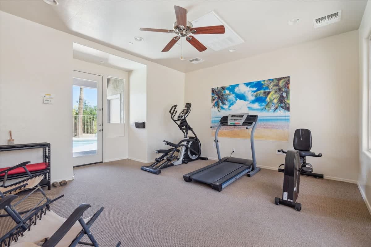 Communal Area: Stay active in the Fitness Area, equipped with an elliptical, treadmill, stationary bike, and yoga mat.