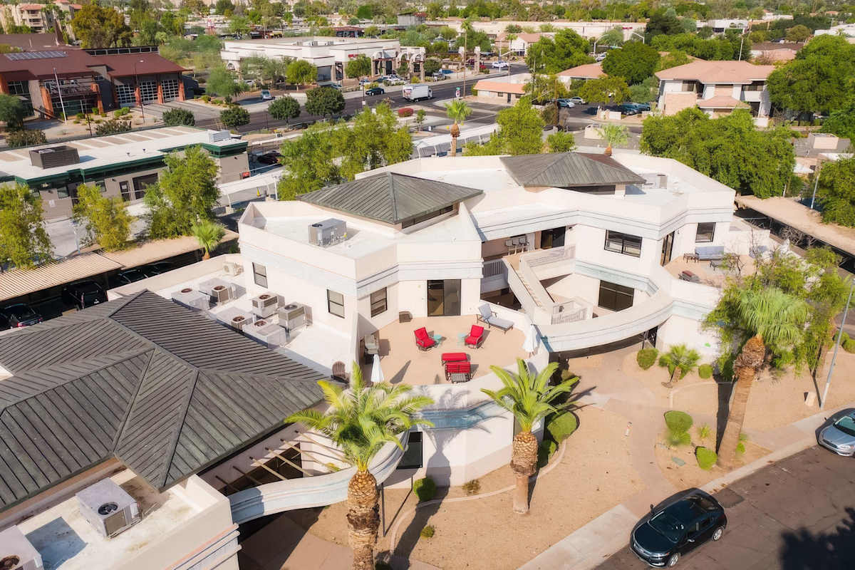 Unit 1: Expansive private balcony featuring lounge seating, a BBQ grill, and plenty of space to soak up the Scottsdale sunshine or unwind in the fresh desert air.