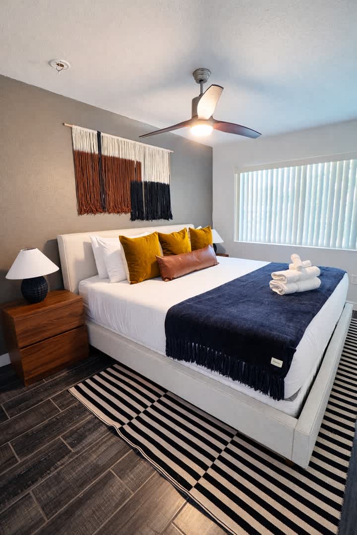Primary bedroom featuring a King bed and a walk-in closet.