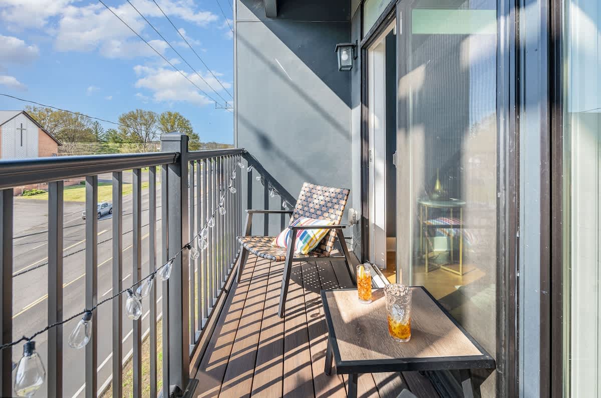 Private balcony with an outdoor seating area.