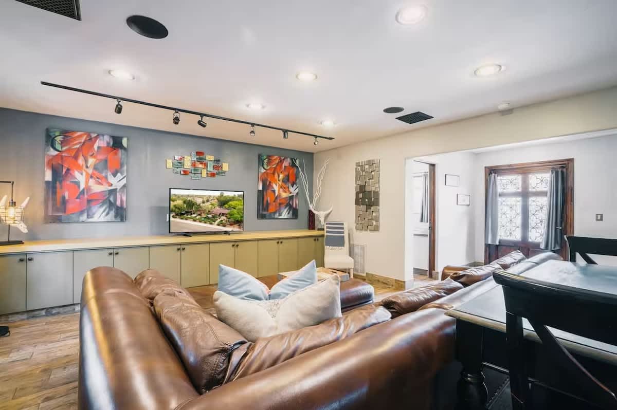 Unit 3: Bright and open living area featuring cozy furnishings and a Smart TV.
