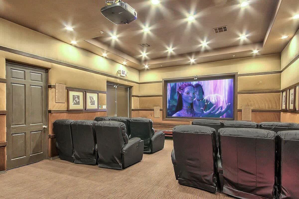 Communal Area: Movie theater with cozy seatings and a projector.