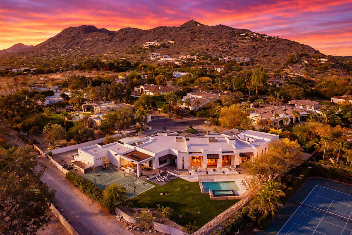 Stunning 7,000 sq ft estate with Mummy Mountain views, resort-style backyard and 1.34 acres of landscaped grounds, just minutes from Scottsdale dining and shopping.