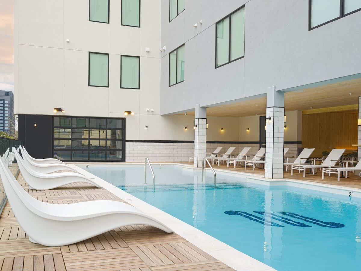Communal Area: The Sparkling blue pool on the 3rd floor has city views and sun loungers.