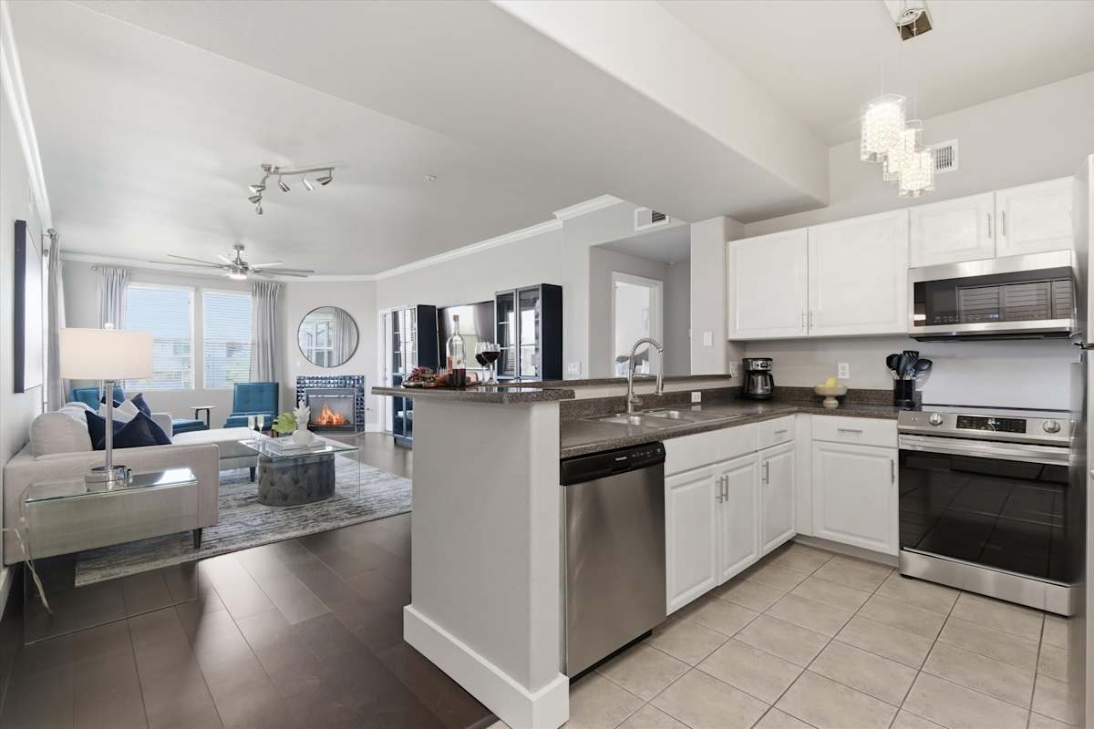 Fully equipped kitchen with stainless steal appliances and ample counter space with bar seating for 3 guests.