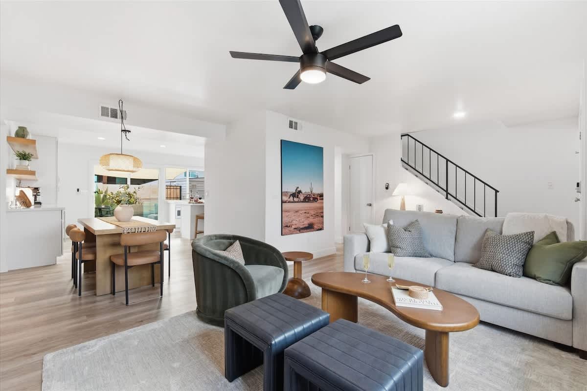 Bright, open living area with comfortable furnishings and a Smart TV, perfect for relaxing together.