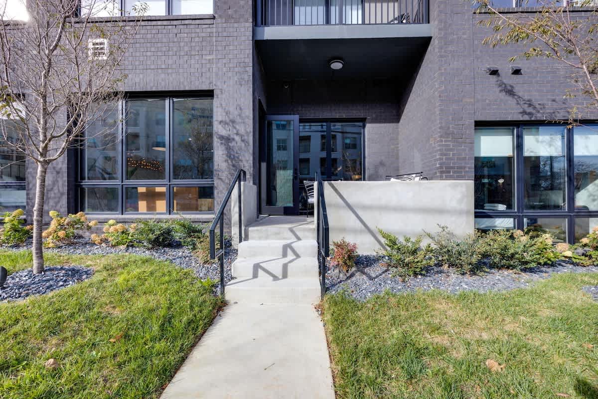 Outdoor patio space accessible from the living area complete with outdoor furniture.