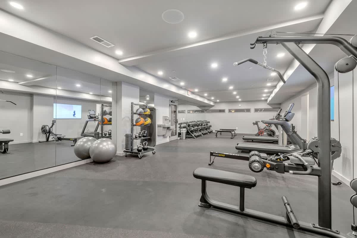 Communal Area: Gym offering a wide range of workout equipment and a smart TV.