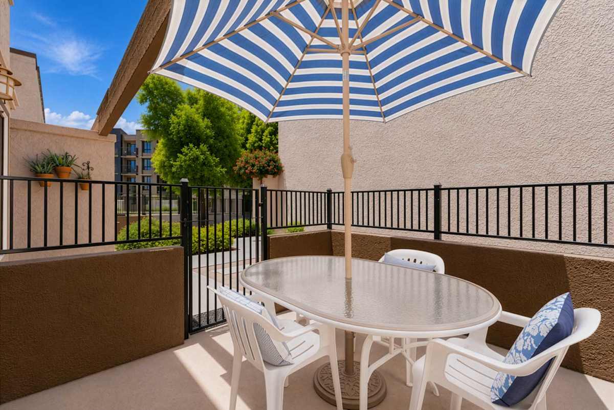 Private Patio with shaded outdoor dining, the perfect spot to enjoy morning coffee, al fresco meals, or a quiet evening in the Arizona sunshine.