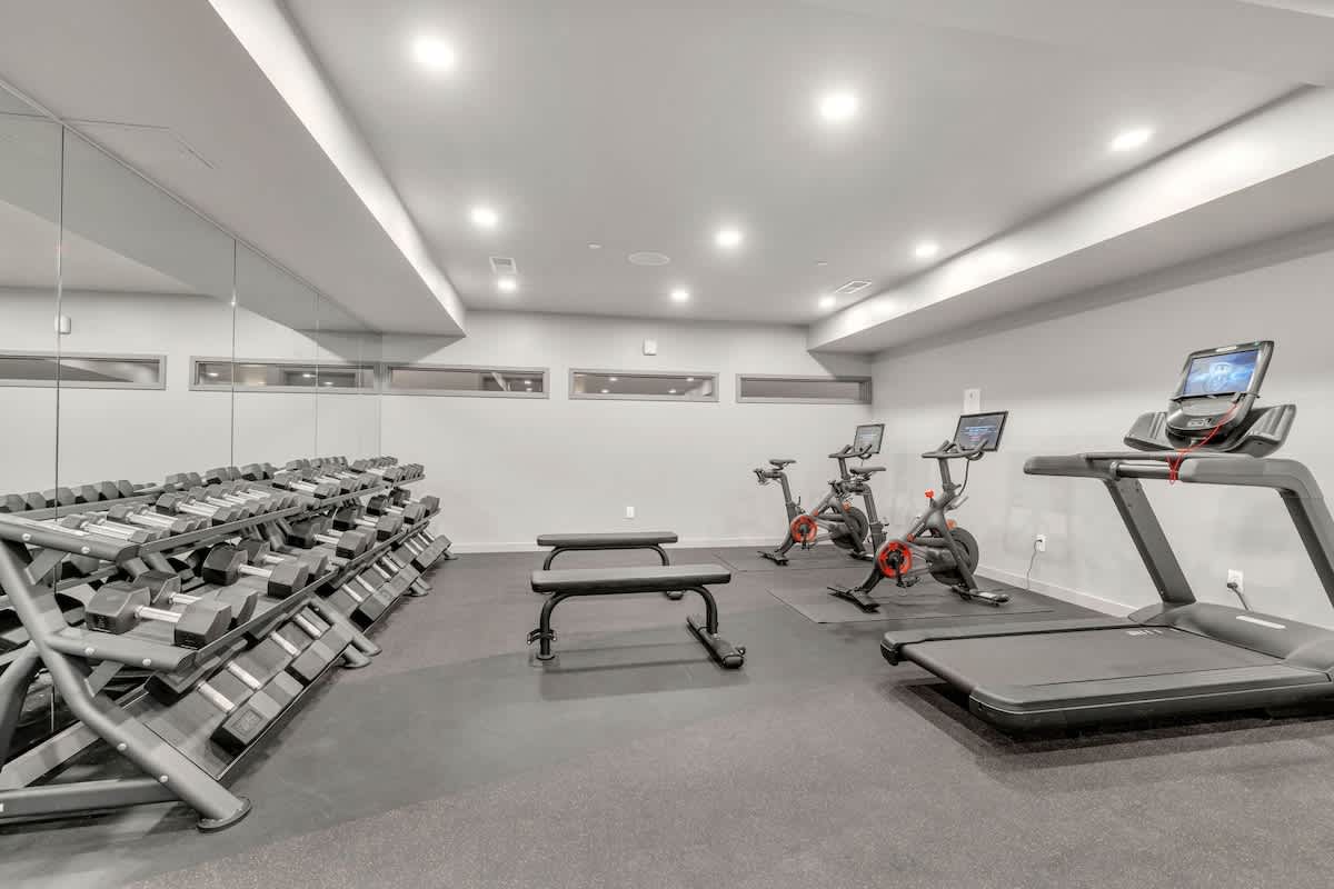 Communal Area: Gym offering a wide range of workout equipment and a smart TV.