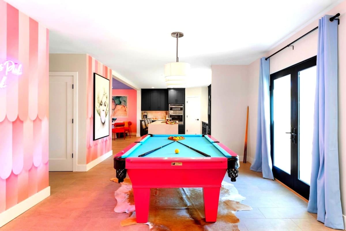 Home 1: Pool table next to the kitchen and the entrance of the home.