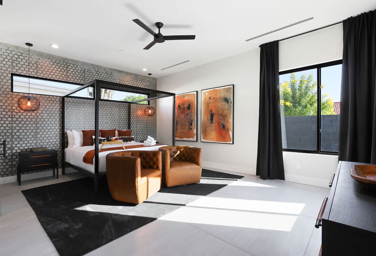 Primary Bedroom featuring a King bed, Designer furnishings, a Smart TV, and En-suite bathroom.