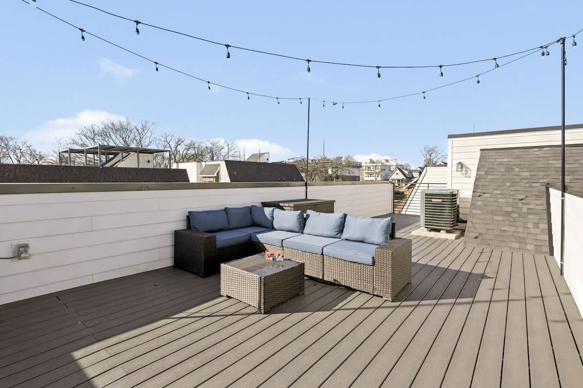 4th Floor: Rooftop patio with an outdoor lounge area and a view of the Nashville skyline.