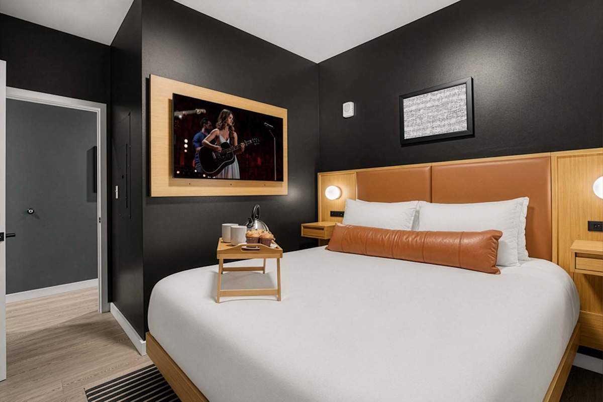 The primary bedroom has a Queen bed and a smart TV.