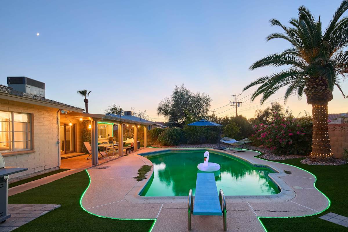 Take the plunge off the diving board into the sparkling pool, then dry off under the covered patio's fire pit lounge or challenge someone to ping pong, with a hammock and lush grass rounding out this
