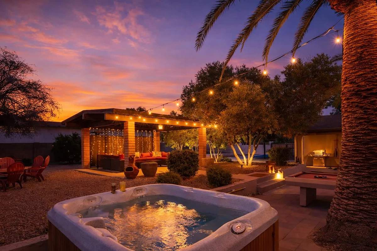 Sparkling pool, hot tub, sun loungers, gazebo, firepit, BBQ, cornhole, and ample seating.